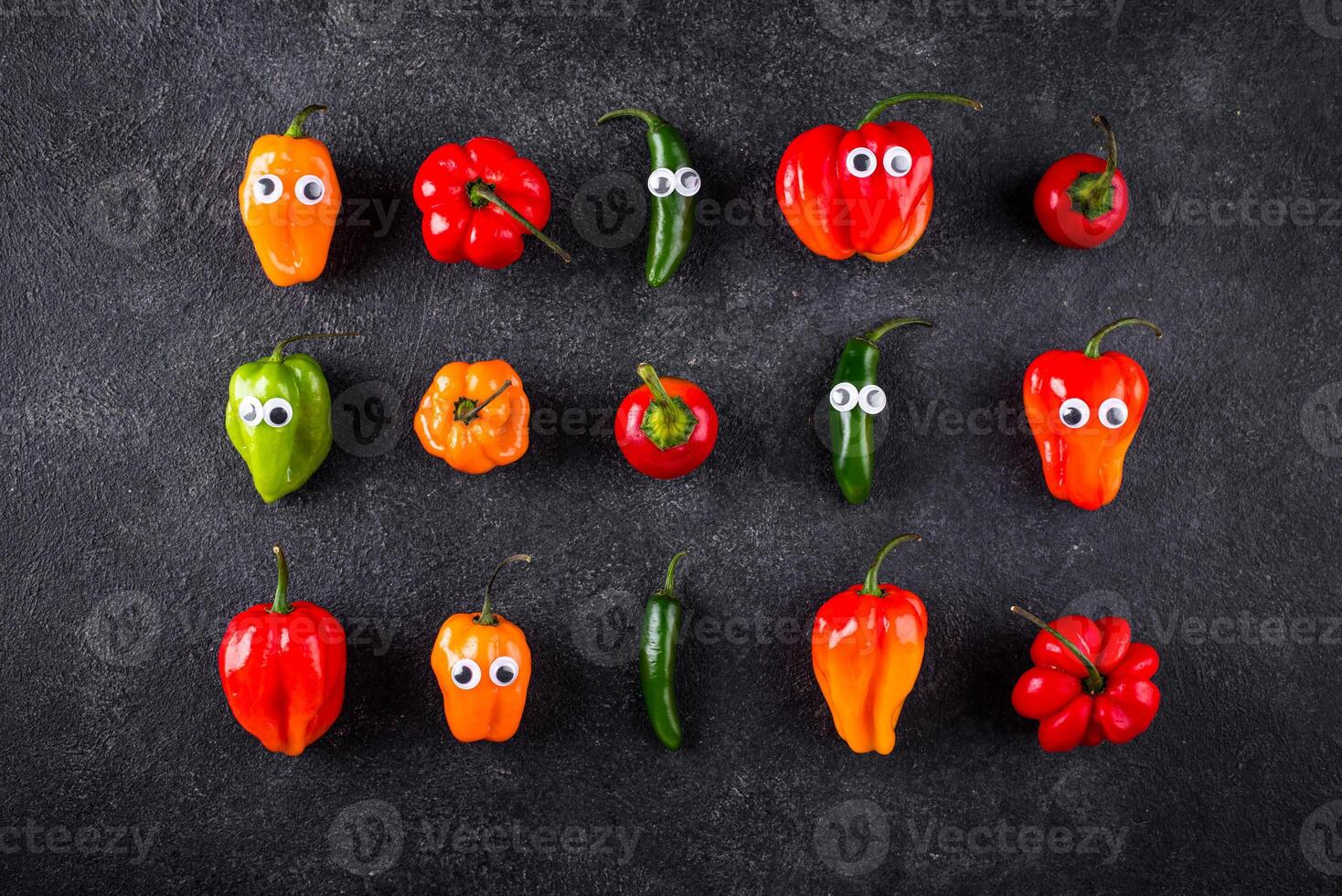 Cute color bell pepper with eyes. photo