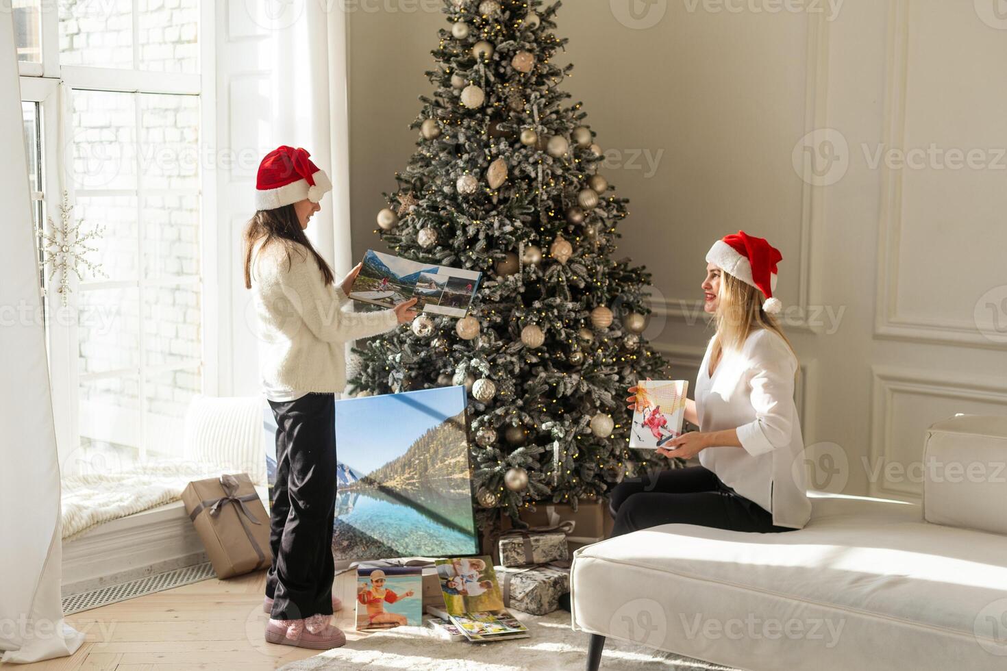 Canvas prints. A woman holding photograph with gallery wrap. Landscape photo printed on glossy synthetic canvas and stretched on wooden stretcher bar