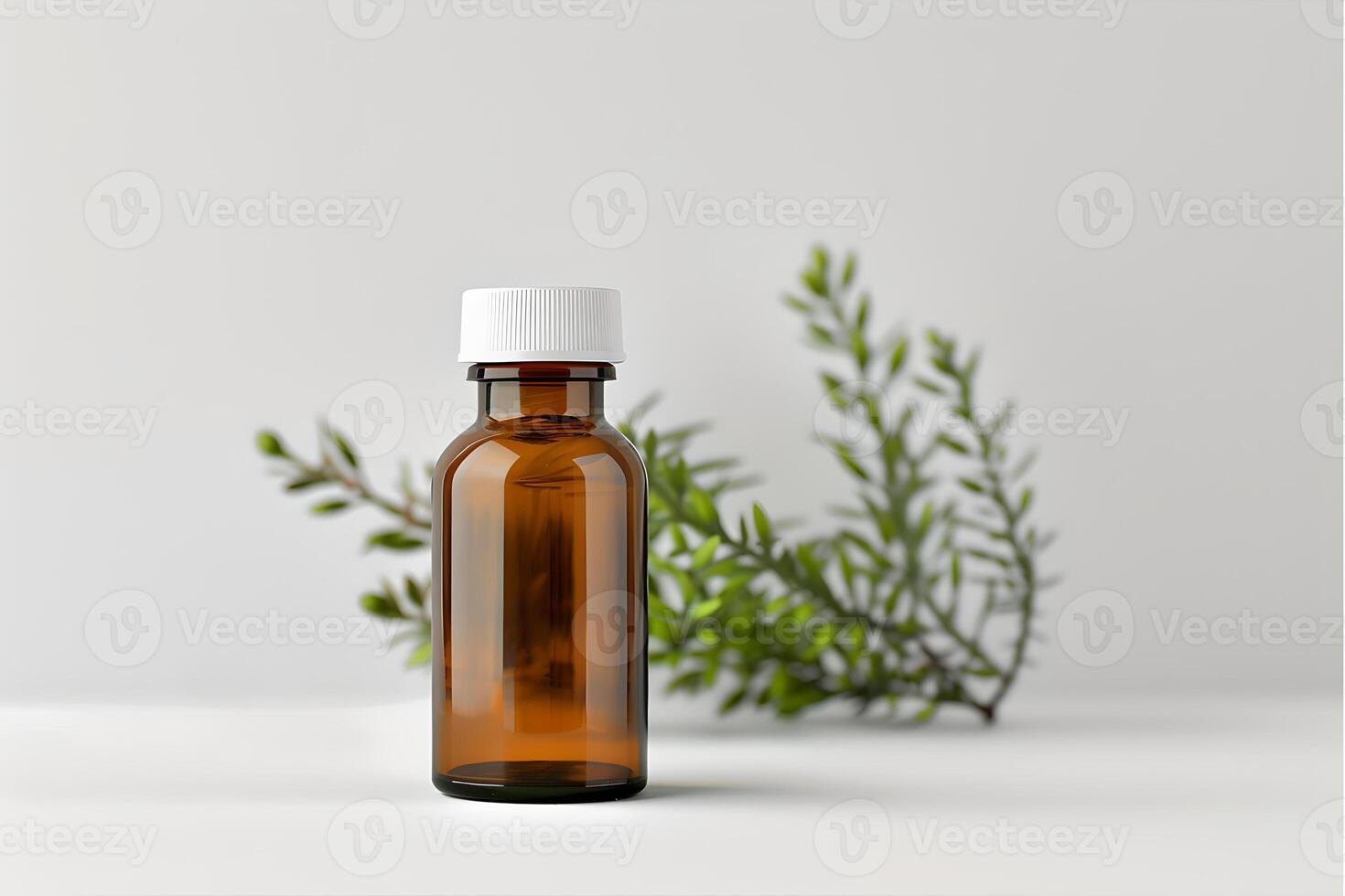 Glass bottle mock up for cosmetics, natural medicine, essential oils or other liquids. Brown closed cap packing, front view on white background with green herbal plant photo