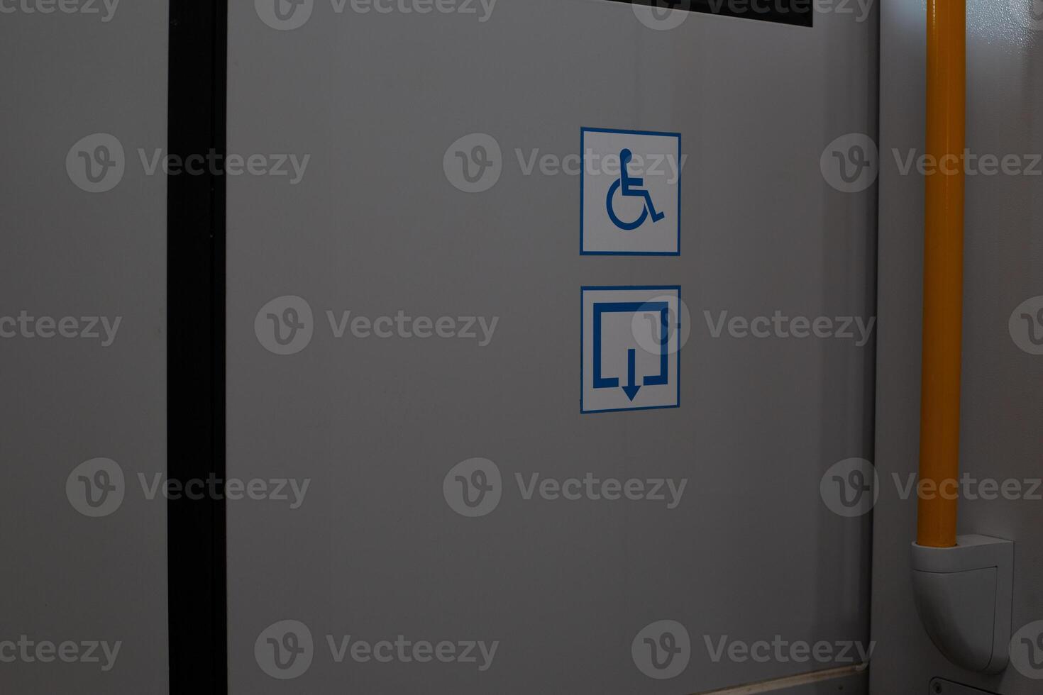 Ramp sign for disabled people in public transport, ramp for wheelchairs in train, sticker about an accessible way to get off the transport photo