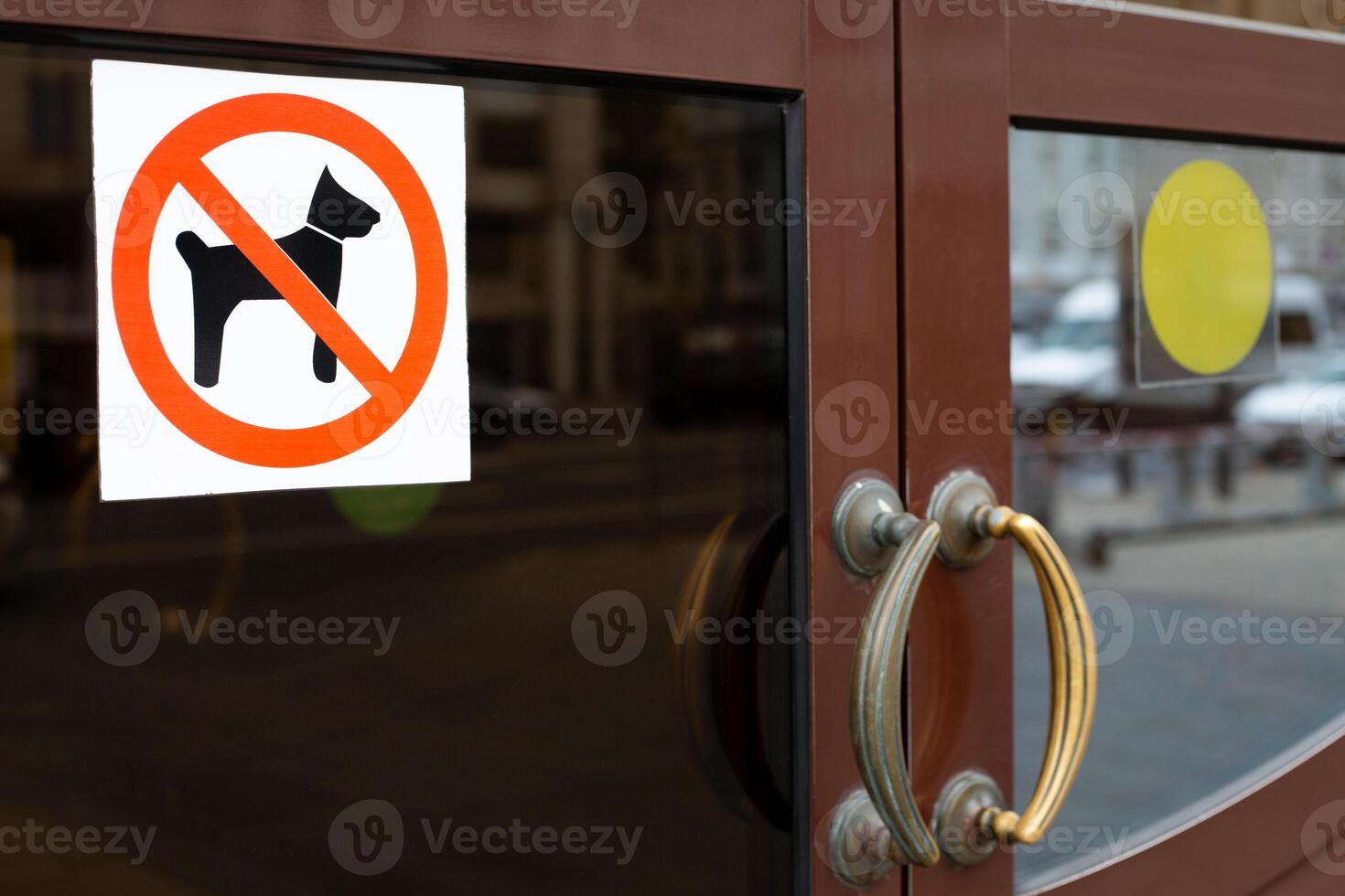 Sign prohibiting entry to an establishment with dog, sticker prohibiting entry with pet, badge with dog crossed out in red on door, icon ban with animals with crossed out silhouette of dog photo