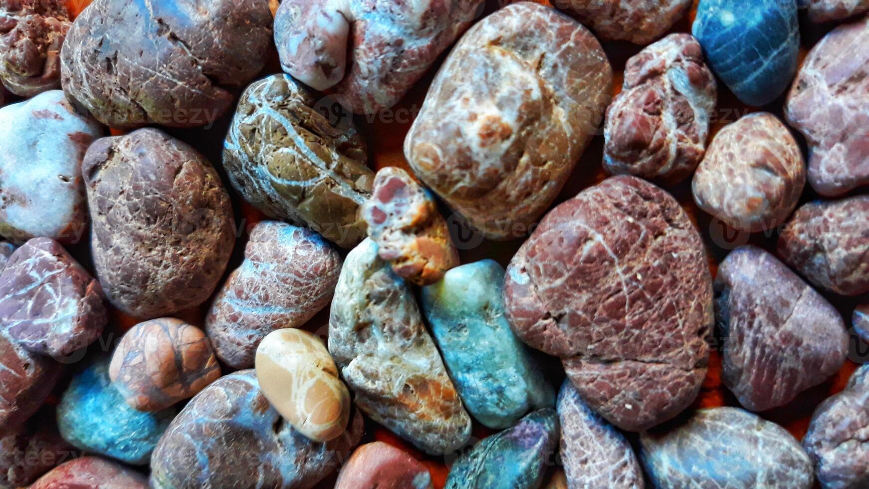 A pile of rocks with different colors and shapes photo