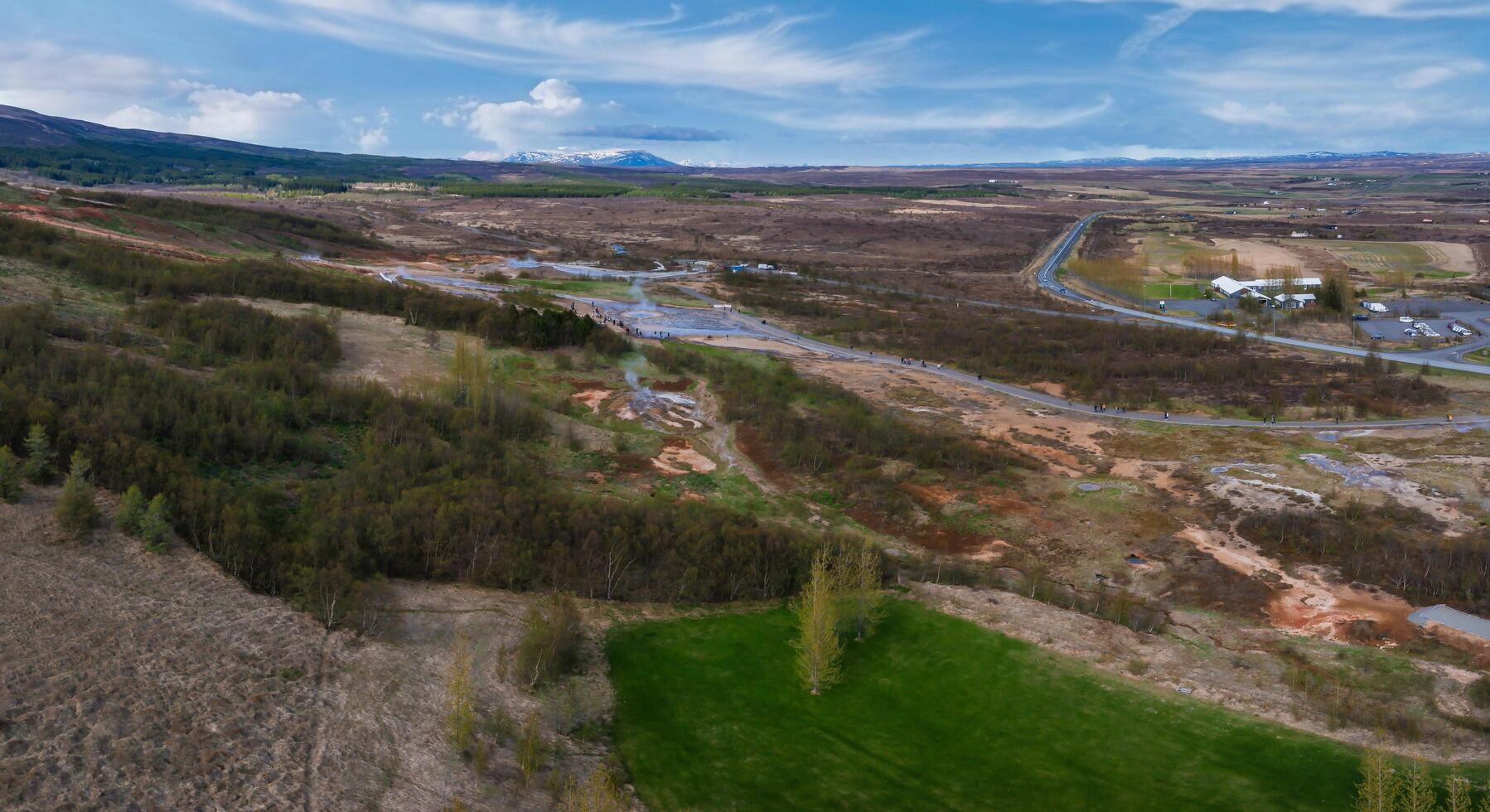 Aerial View of Winding Road Through Verdant Valley in Iceland photo