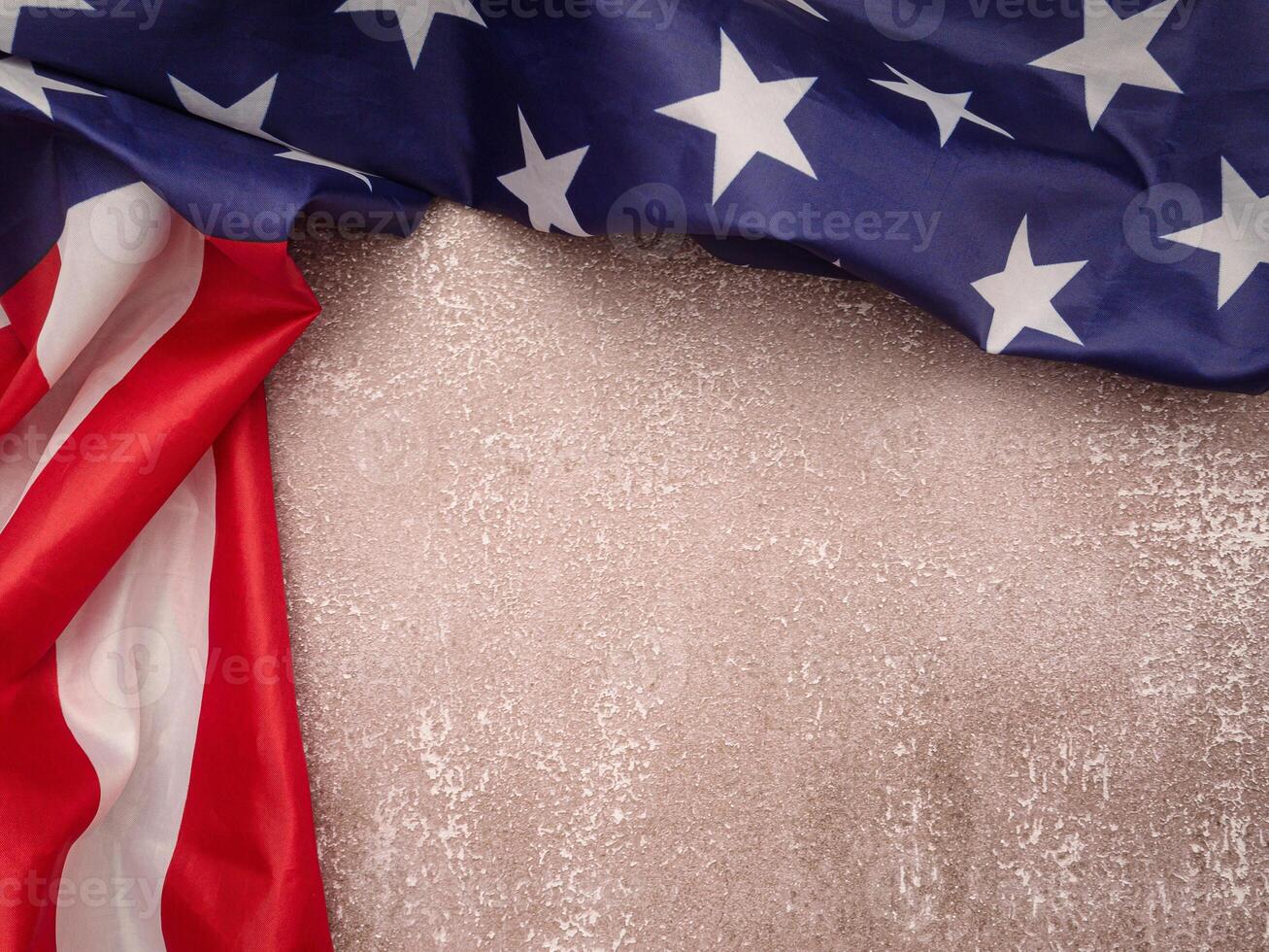 Top view of the American flag on a cement floor with copy space for text. photo