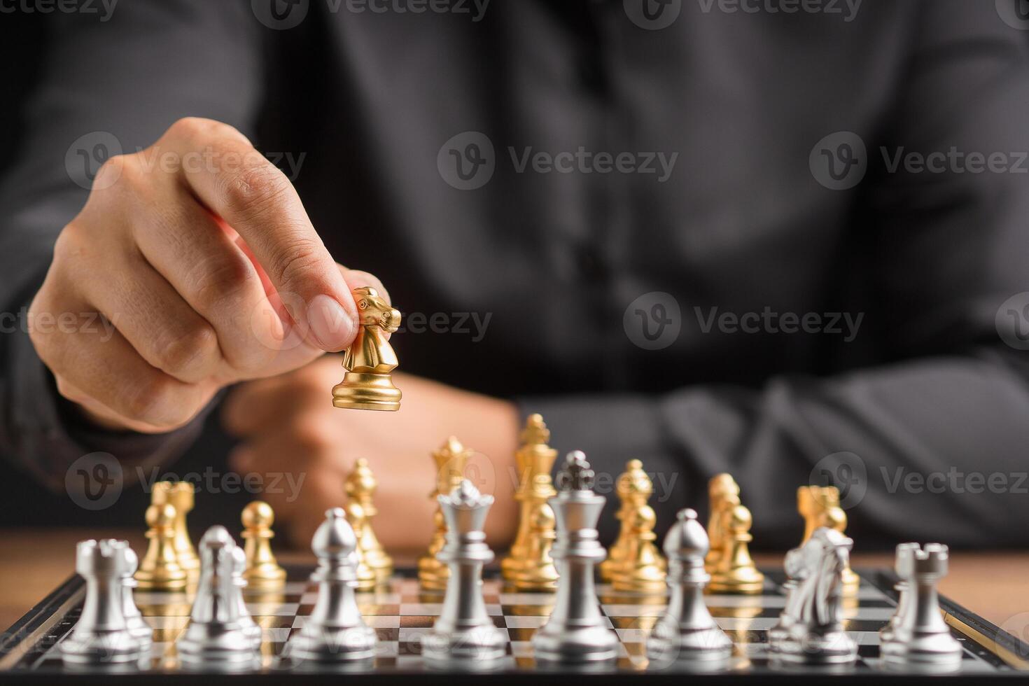 Businessman playing with chess game. Business strategy ideas and investment photo
