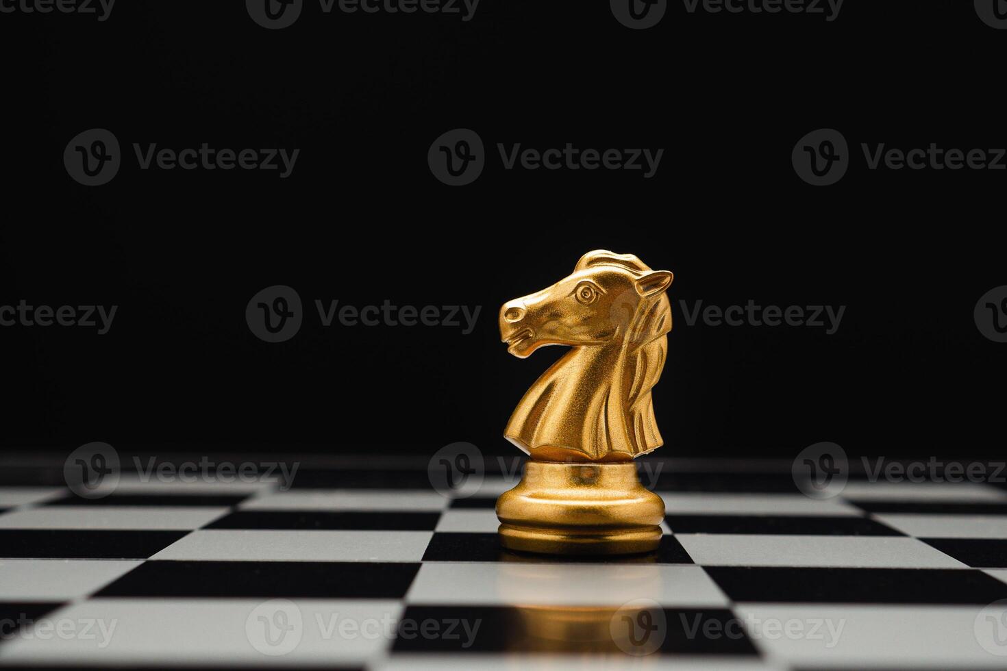 Chess piece on board game planning and competition on black background. photo