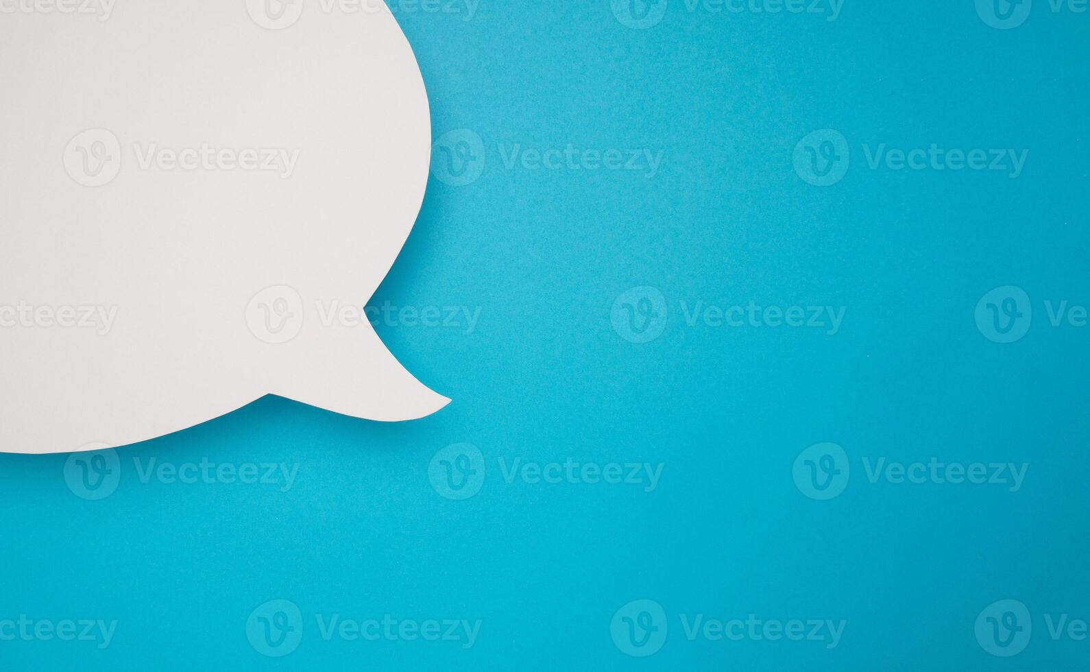 Blank white speech bubble part on a blue background photo