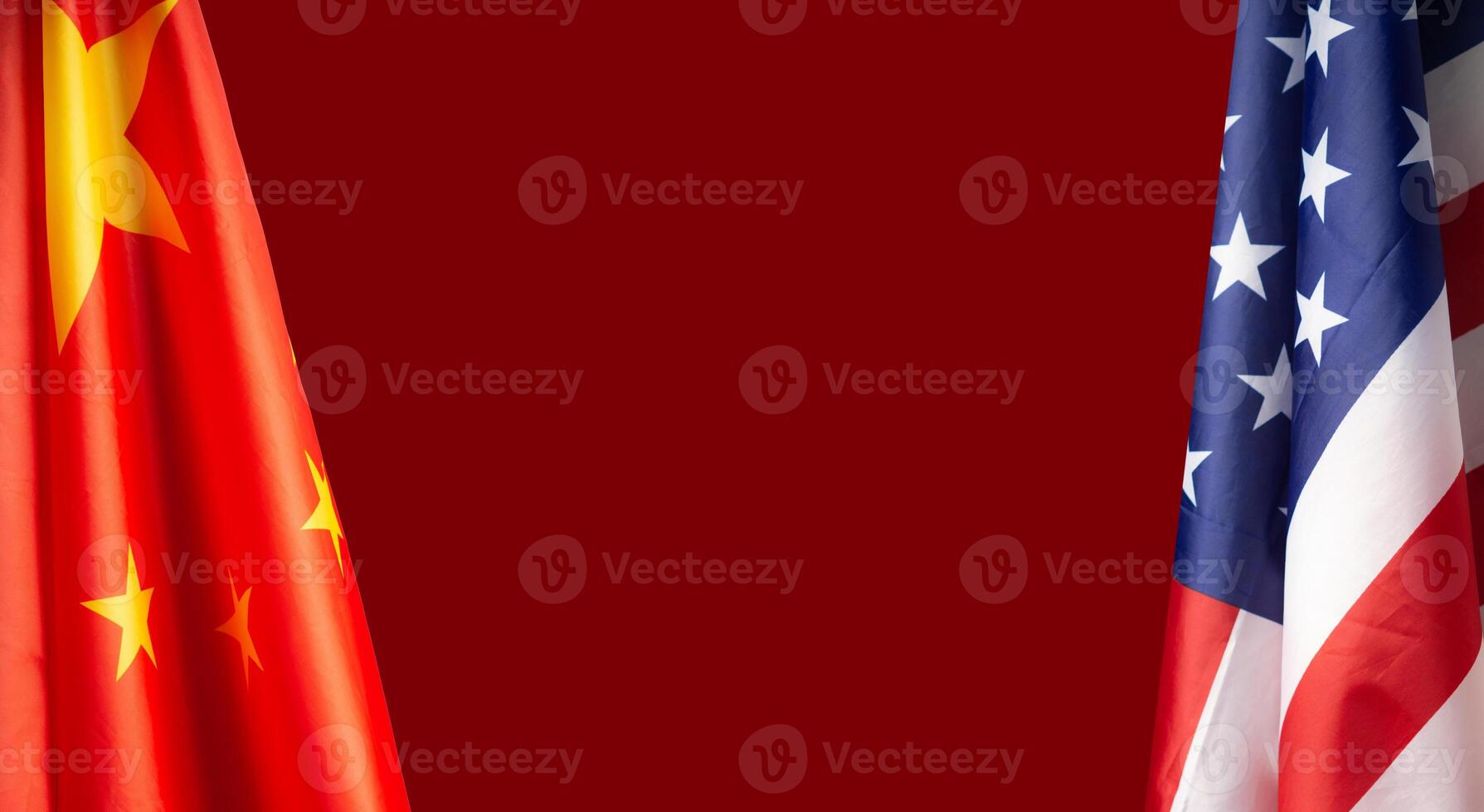 The Chinese and American flags over a red background photo