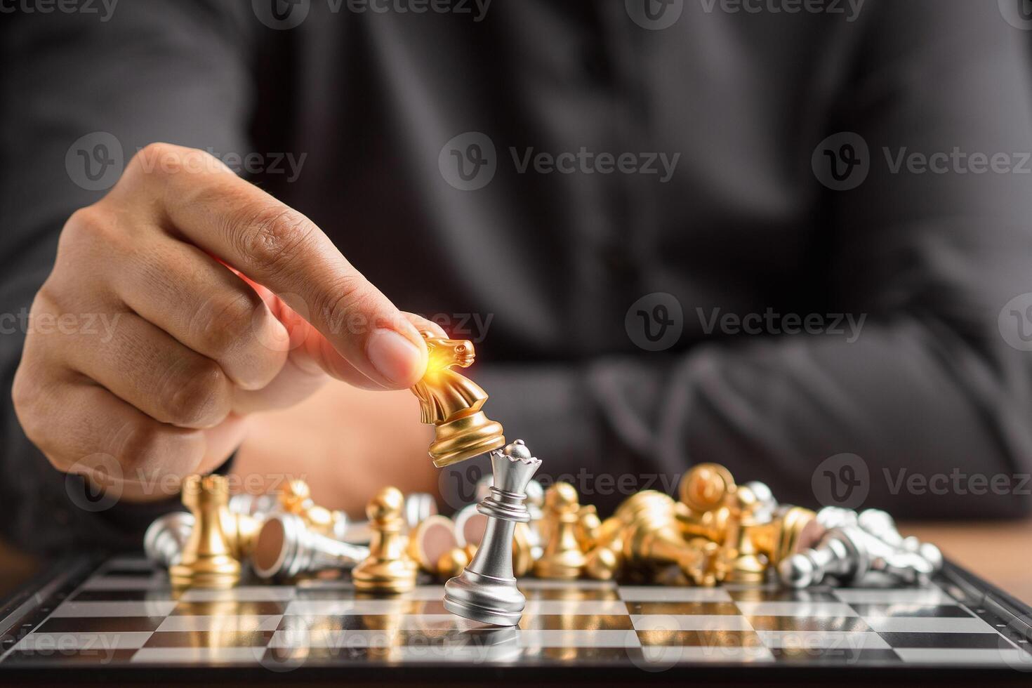 Businessman playing with chess game. Business strategy ideas and investment photo