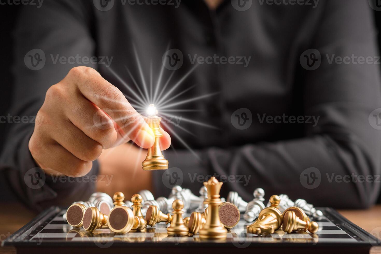 Businessman playing with chess game. Business strategy ideas and investment photo
