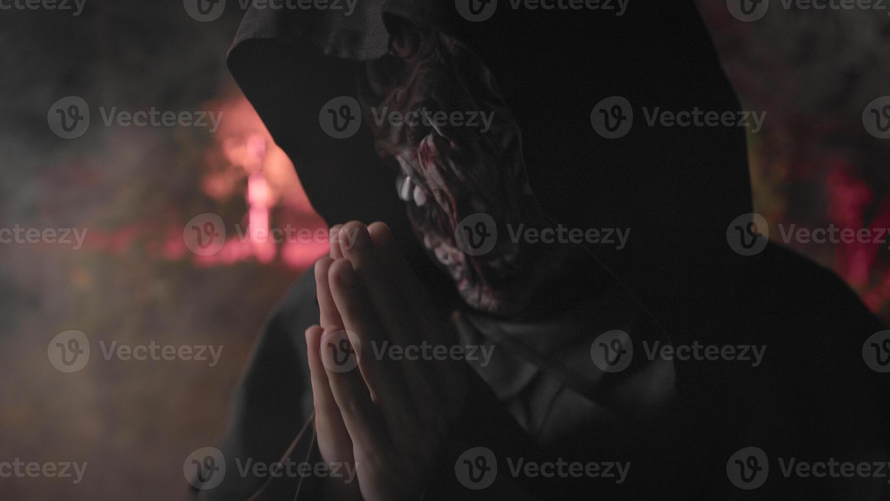 Monk With monster face Praying for Soul in the night forest for Halloween photo