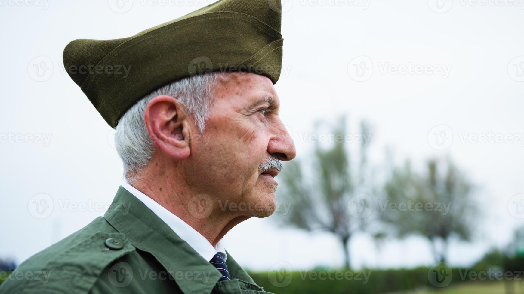 Sad And Moved Military General Silently Watches the Flag Raising on Memorial Day photo