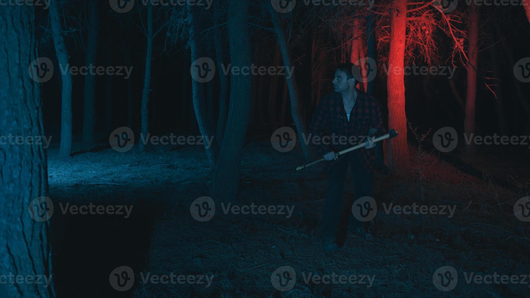 Crazy man with axe in the night photo