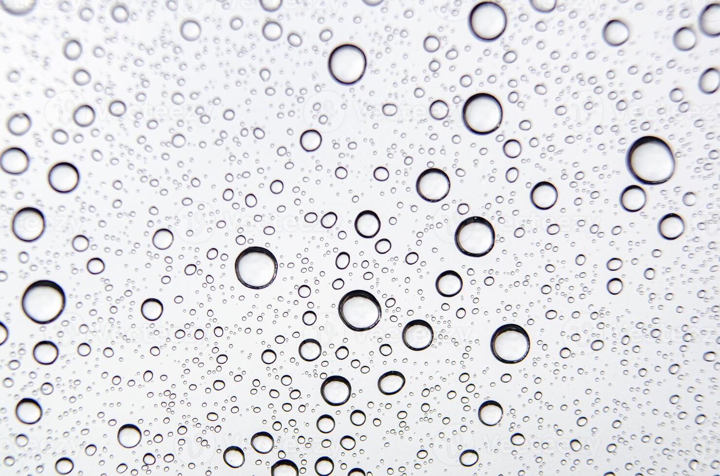 Close-up of water droplets scattered on a smooth surface. Hydration concept. photo