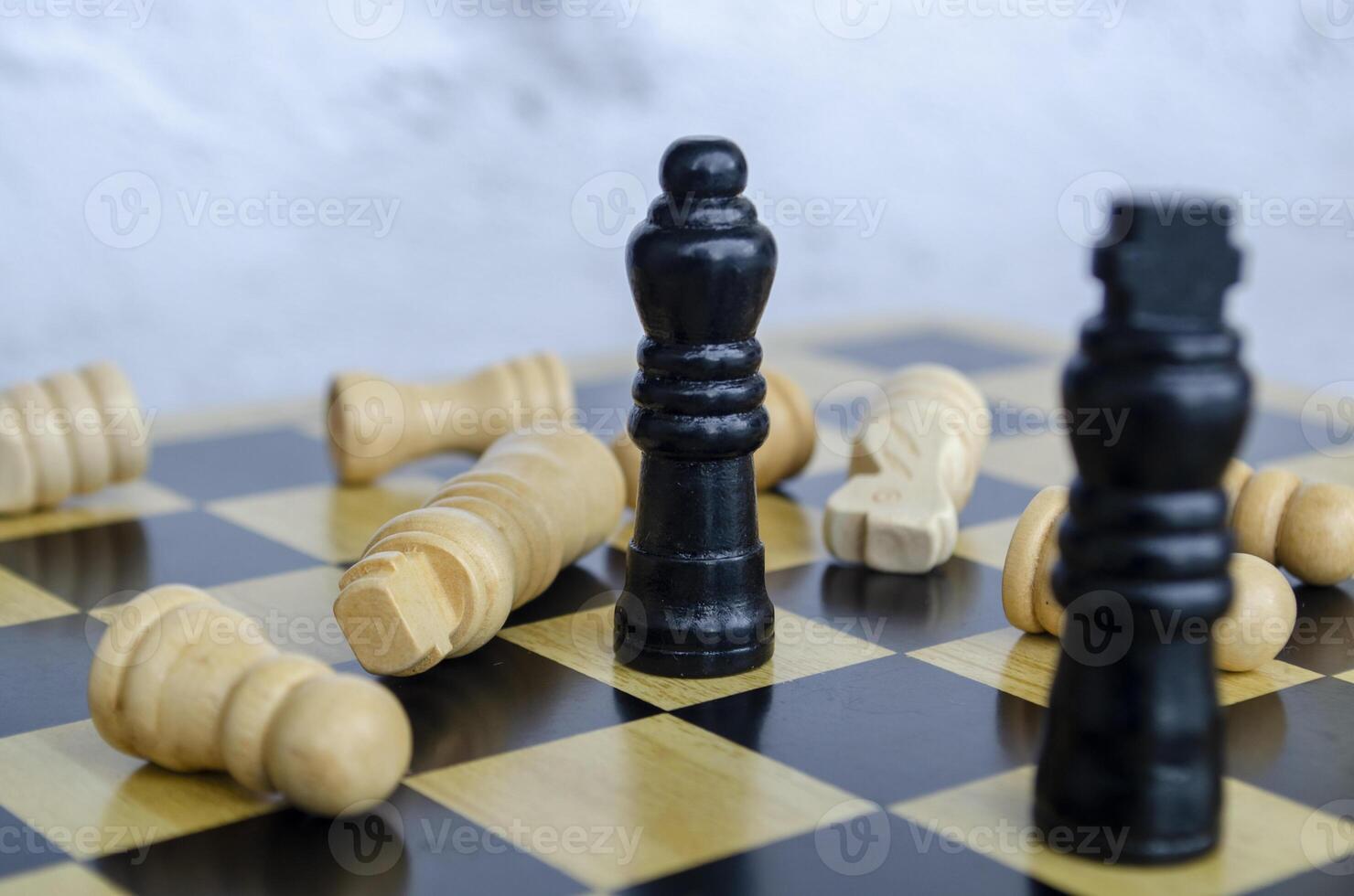 The Kings and Queens clash in a battle of wits. Chess battle concept photo