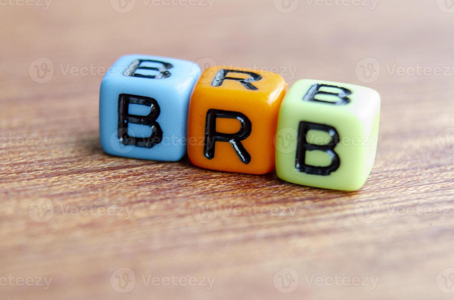 BRB text represent Be Right Back on wooden. Taking a break concept photo