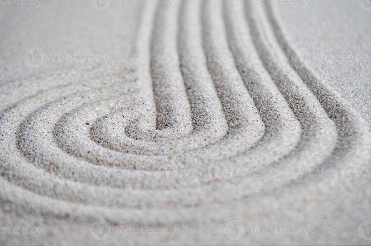 lines and circle formation on beach sand with customizable space for text photo