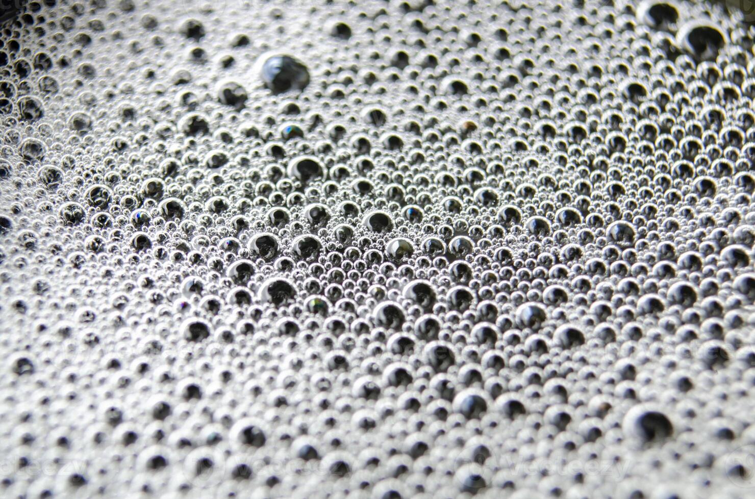 Close up view of bubbles on dark background with customizable space for text photo