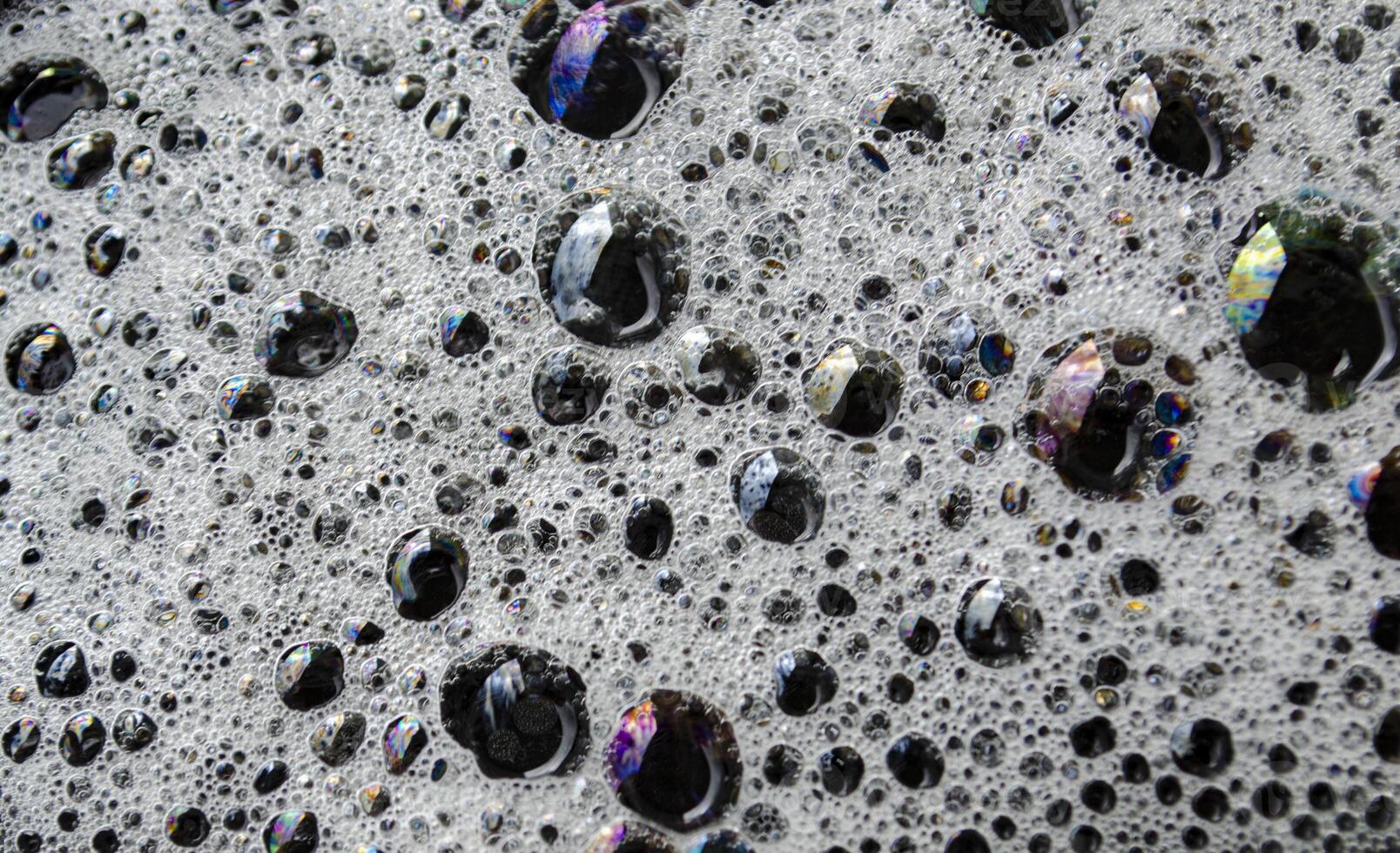 Macro view of bubbles forming on the water surface photo