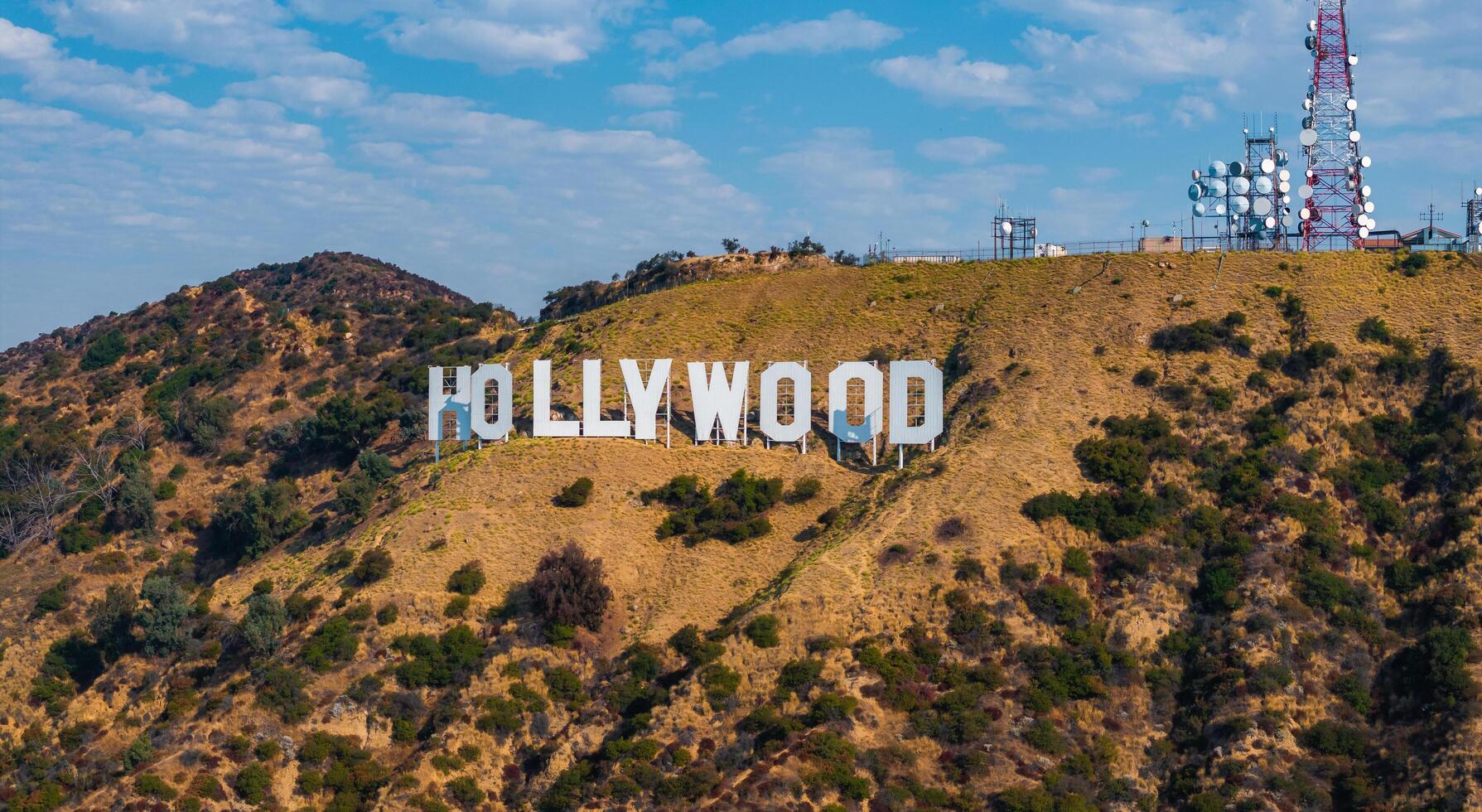 Hollywood Sign on Rolling Hills with Communication Towers photo