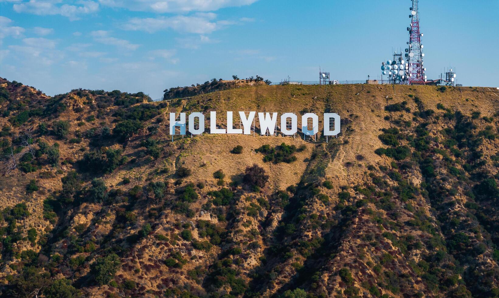 Hollywood Sign on Los Angeles Hills with Communication Towers photo