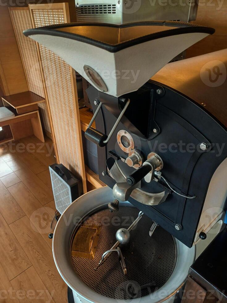 Mini Modern roasting machine with the professional coffee roaster. photo