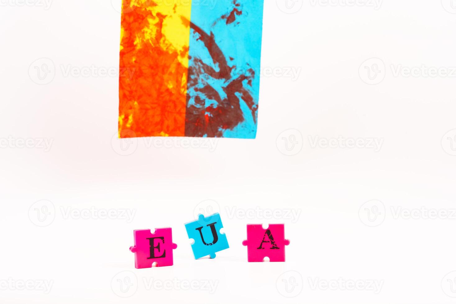 Flag of Ukraine with blood and puzzles with letters of Ukraine on a white back. As the symble of struggle photo