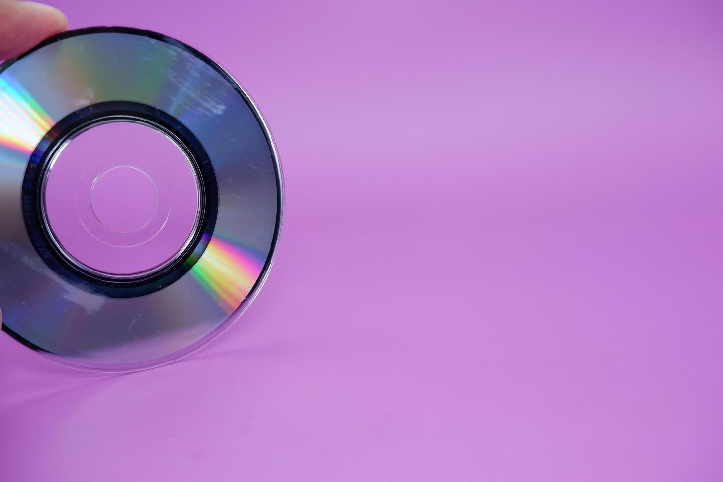 a compact disc isolated on purple background photo