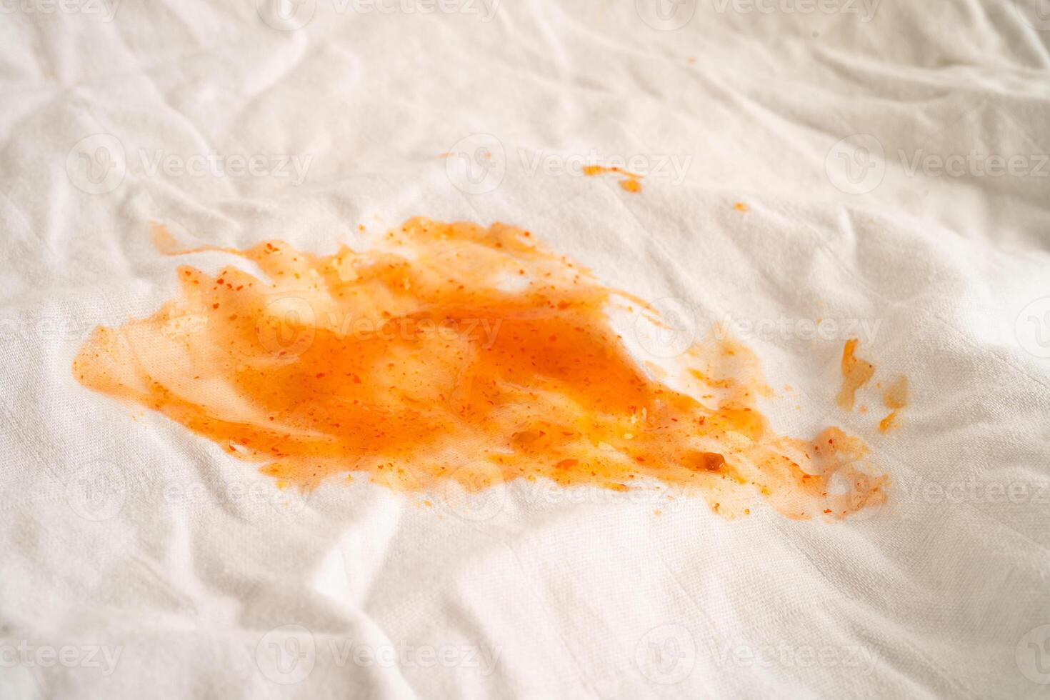 Dirty tomato sauce stain or ketchup on cloth to wash with washing powder, cleaning housework. photo