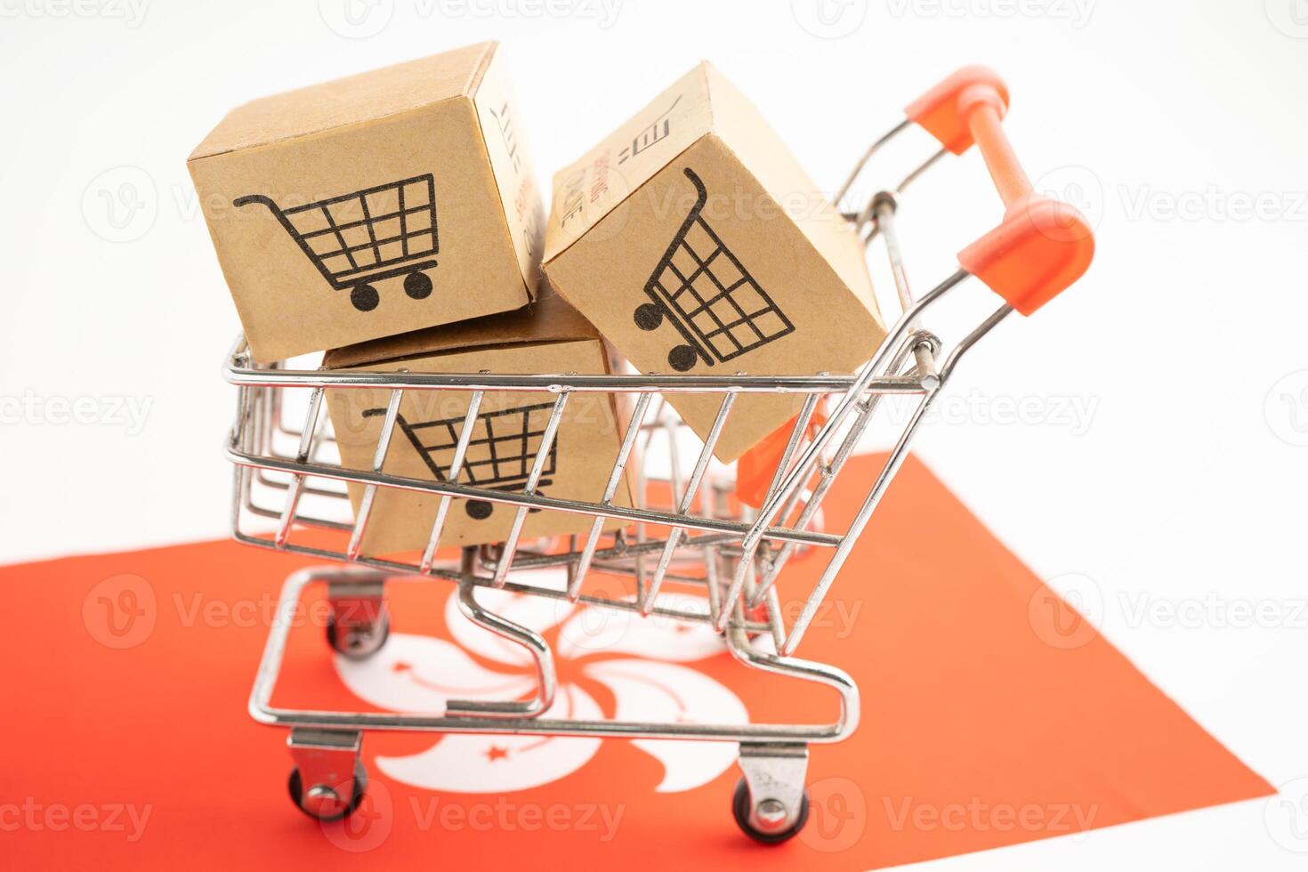 Box with shopping online cart logo and HongKong flag, Import Export commerce finance delivery trade. photo