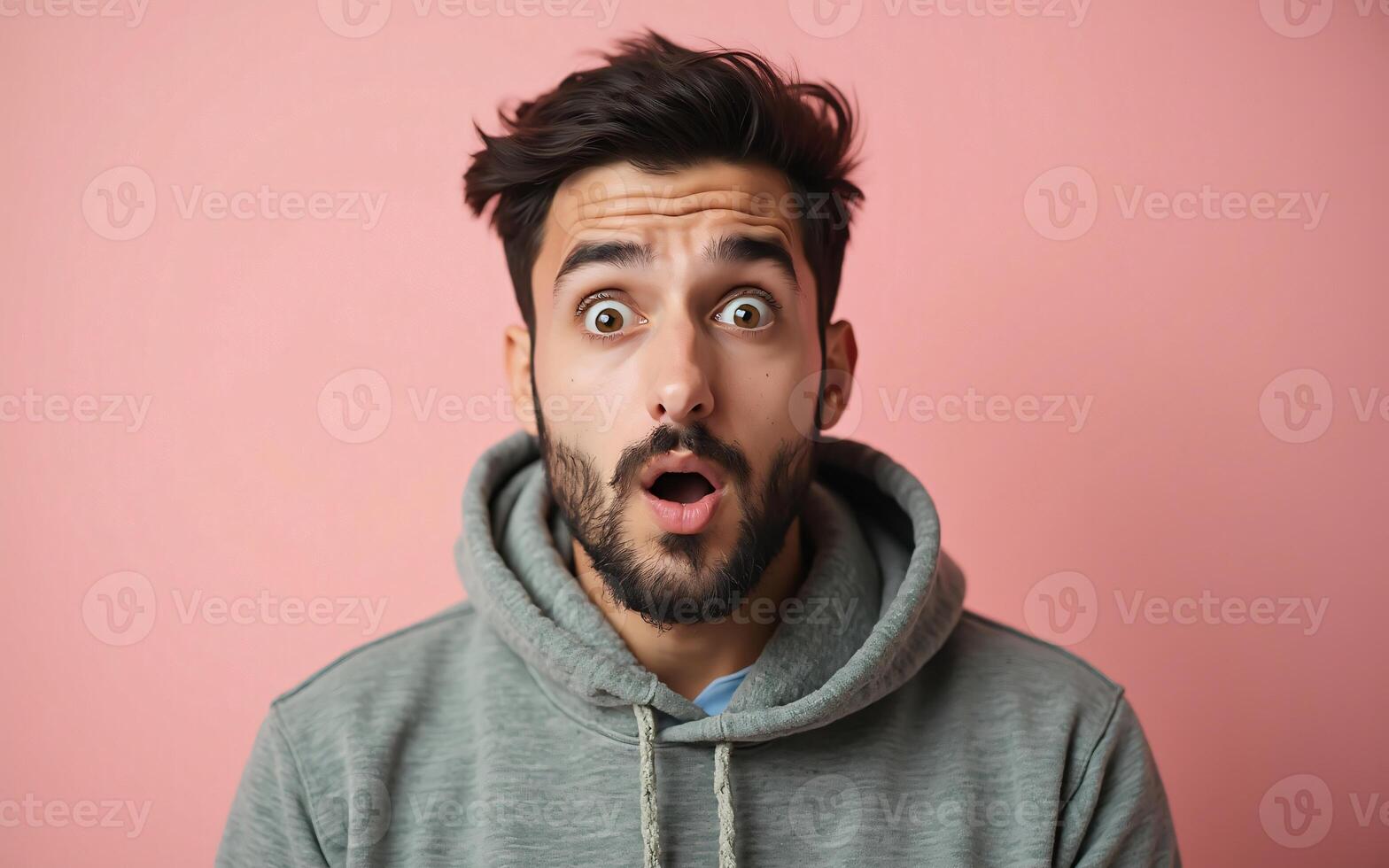Young arab man surprise or shocked facial expression, on a pink background photo
