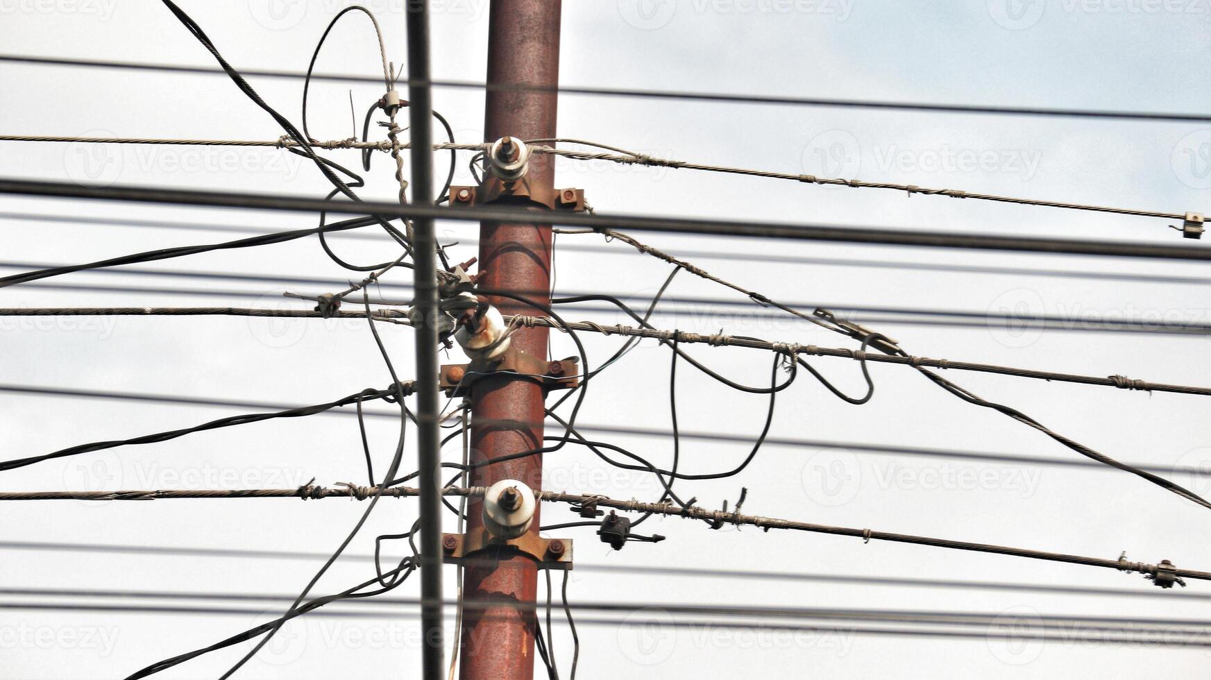 Tangled electrical cables. In Indonesia. Unsafe, dangerous. Not neat photo