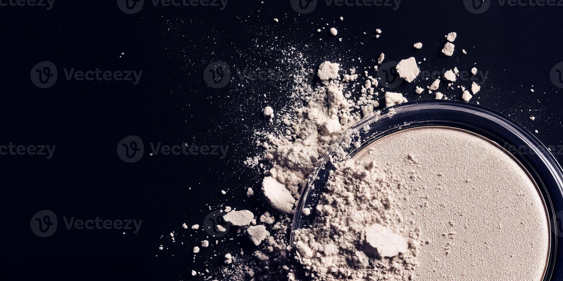Fine powder spread on dark surface creating a detailed texture effect photo