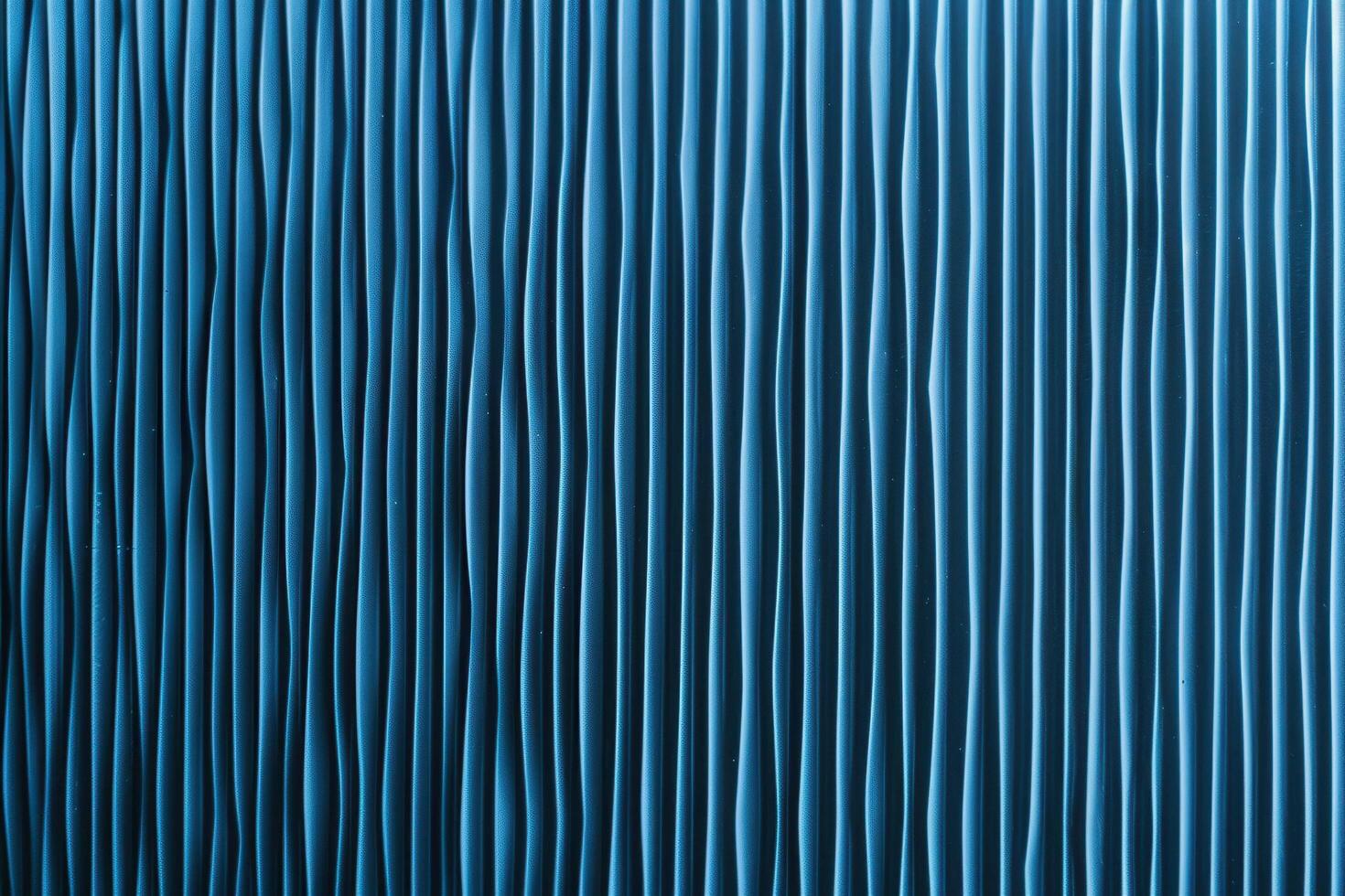 A textured blue background with ribbed patterns running across the surface photo
