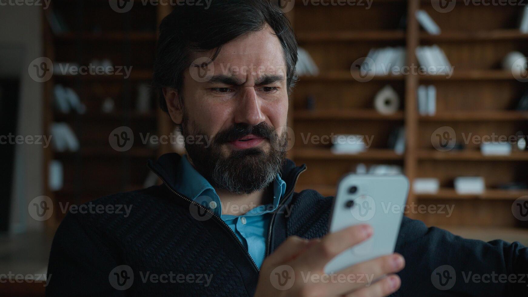 Joyful amazed Caucasian middle aged mature male business man employer boss businessman say what wow holding mobile phone surprised sales discount online offer shock news winning bet indoor office room photo