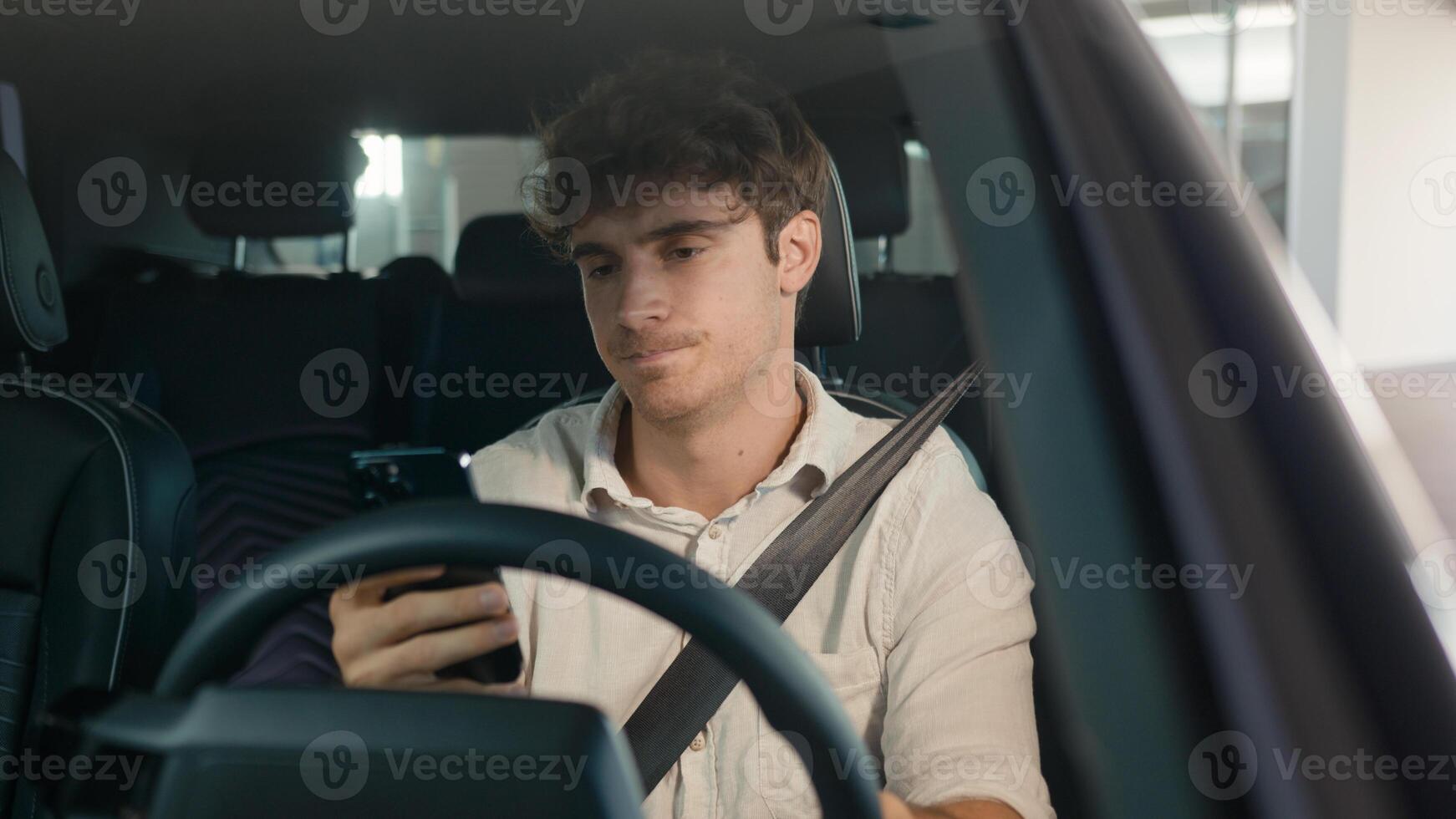 Caucasian confused sad driver upset puzzled male businessman frustrated man stressed business employer in car auto automobile parking lot traffic jam gadget addict lost problem bad news mobile phone photo