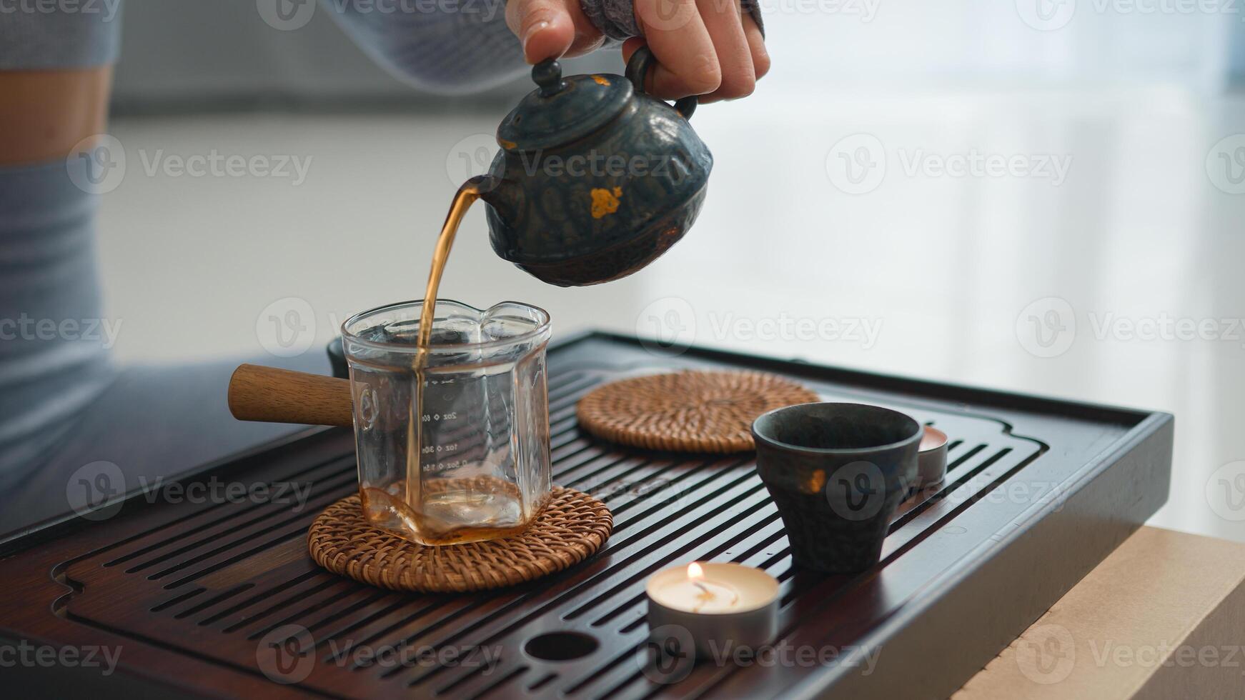 Close up pour black tea ceremony cup drink relaxation freshness refreshment meditation antioxidant beverage detail culture harmony health herbal energy liquid pure teapot hot comfortable break rest photo