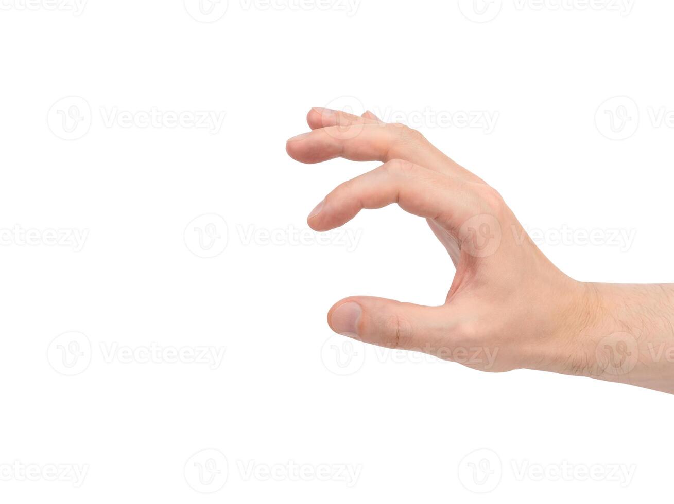 A man's hand holding something small isolated on a white background. photo