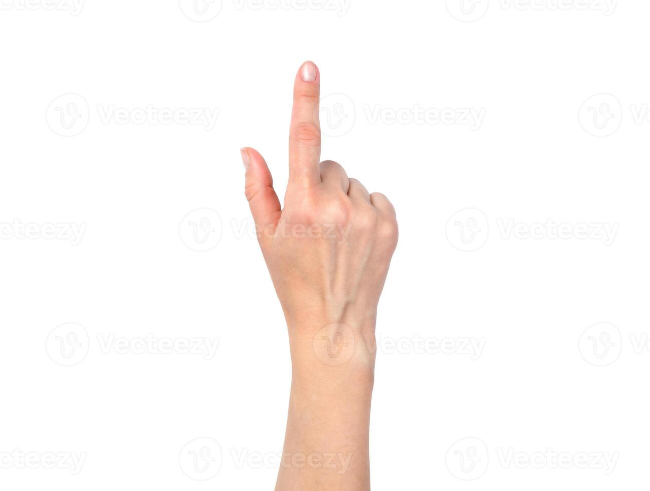 Female hand isolated on a white background. A woman's hand points to something with her index finger. Top view. photo
