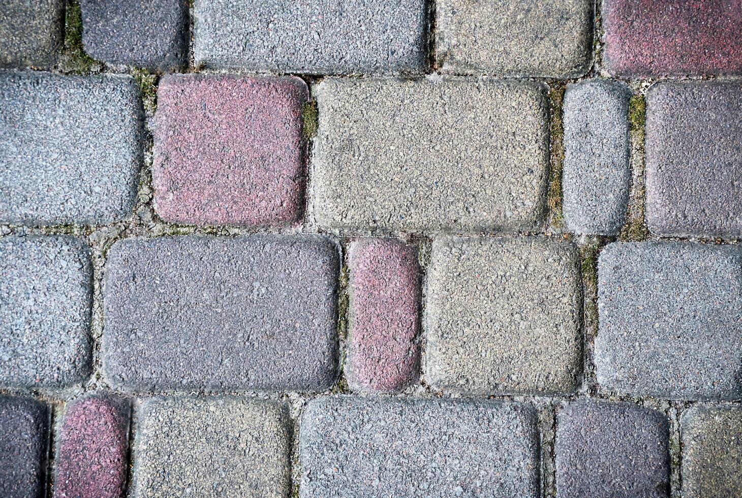 The surface of the sidewalk. Detailed texture of a stone pedestrian walkway. Top view. photo