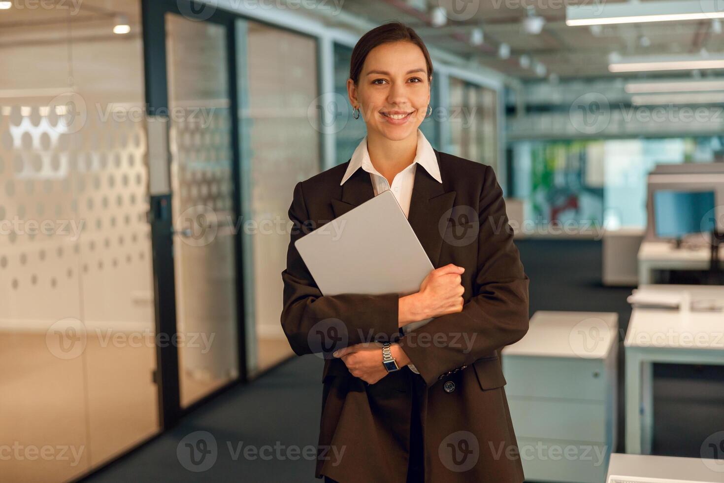 Businesswoman with documents in modern office, showing professionalism and leadership photo