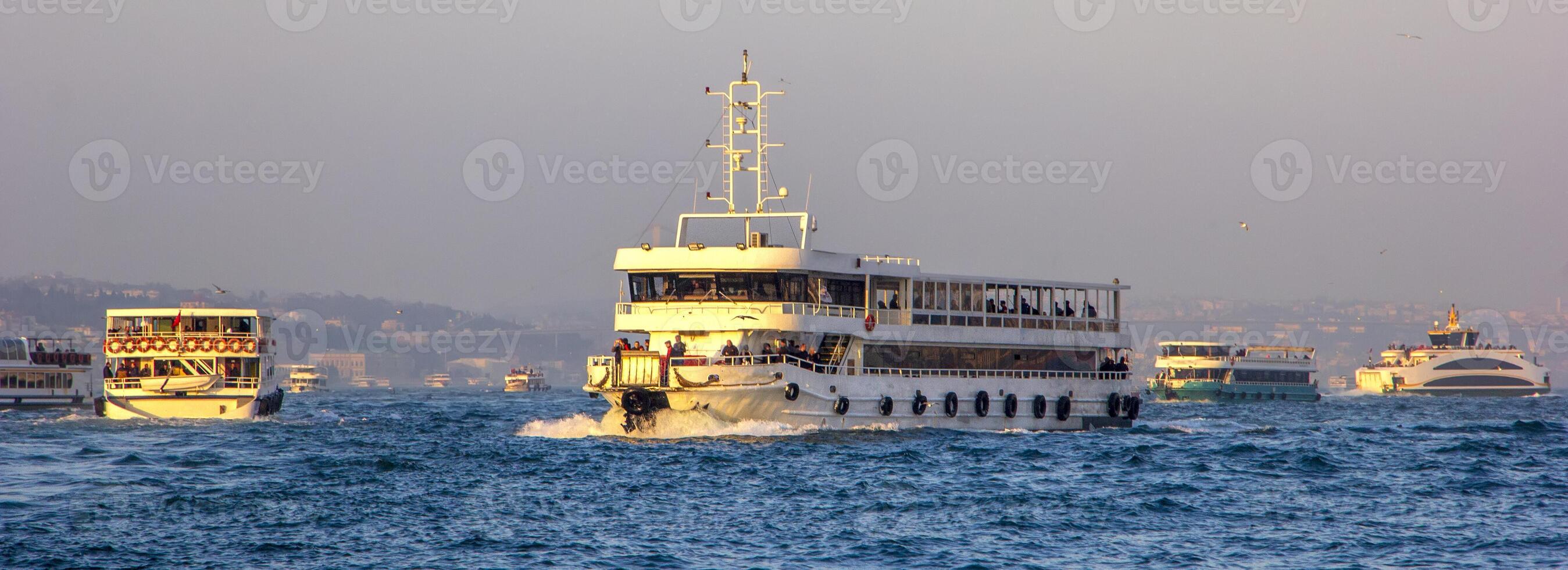 Panoramic view of passenger ships in the Bosphorus, Istanbul photo