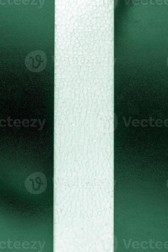 Background with the white center line on a dark green background. Vertical view photo