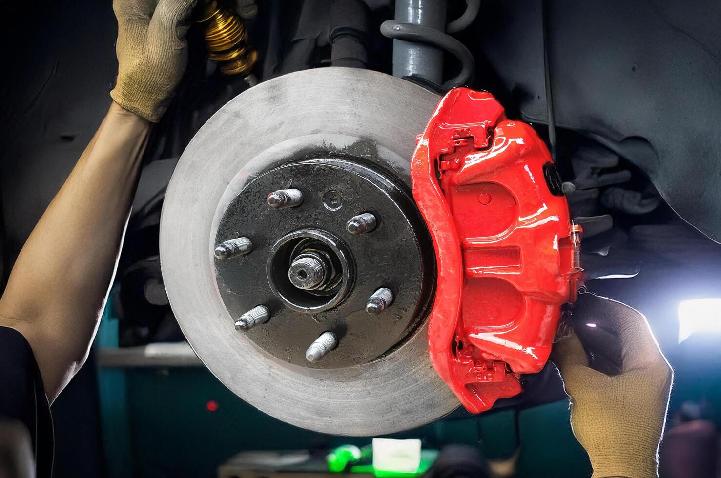 A person is working on a brake disc photo