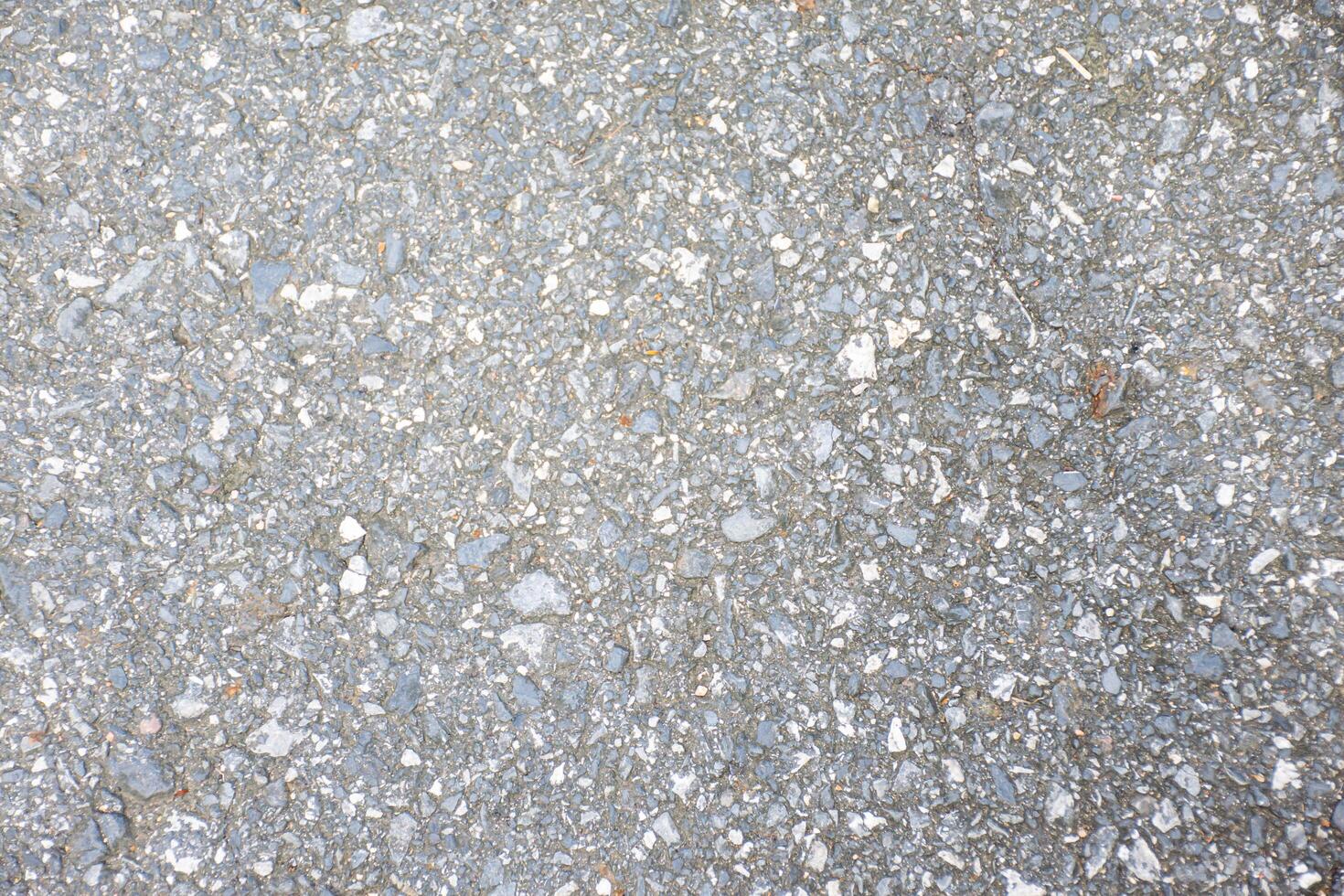 Textured Gray Asphalt Surface for Background Use photo