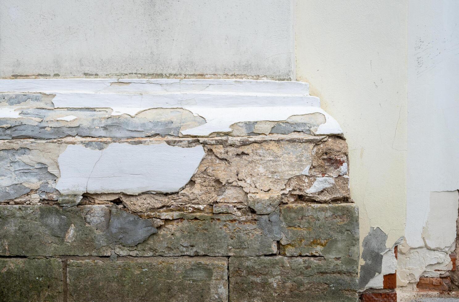 Fragment of the wall of an ancient temple with columns. Selective focus photo