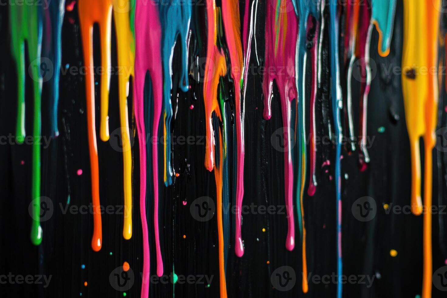 Colorful paint drips create an abstract art piece on a dark background in a creative studio setting photo