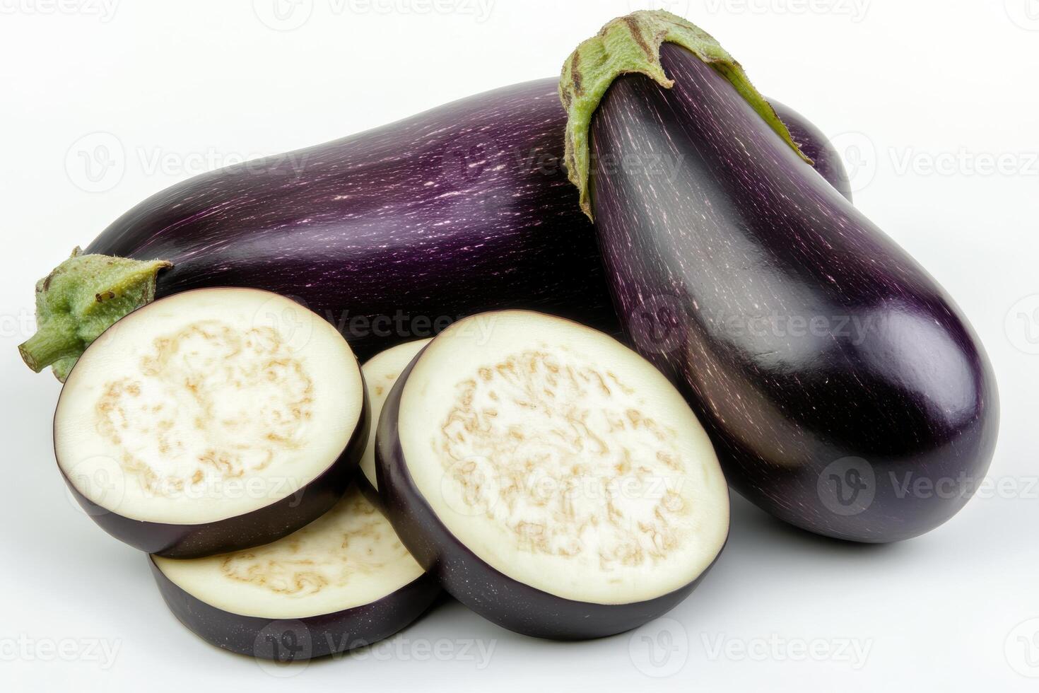 Freshly harvested eggplants displayed on a light background with sliced pieces showcasing the inner texture and color photo