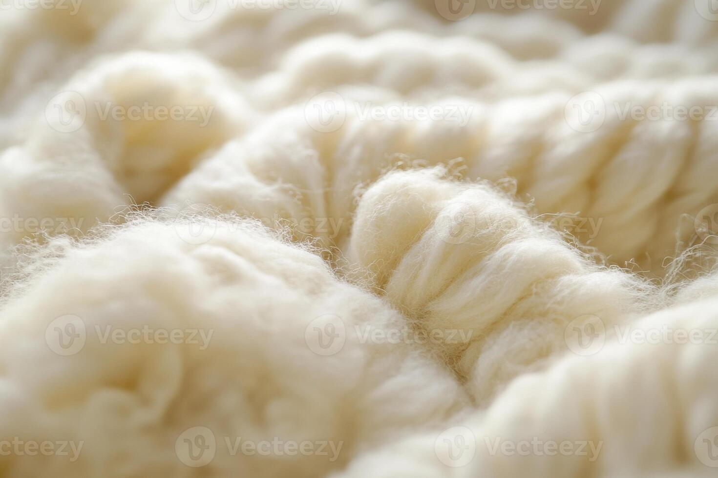 Soft cream-colored fibers intertwined in a cozy pattern on a textile background photo