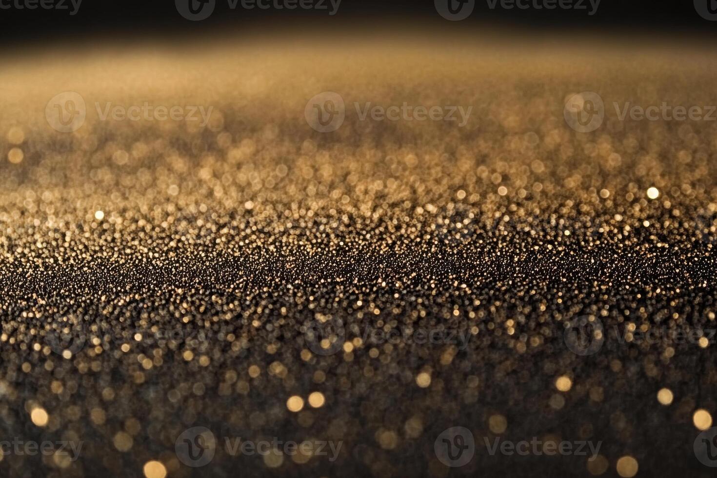 Golden particles shimmer against a dark background in a close-up view during soft lighting photo